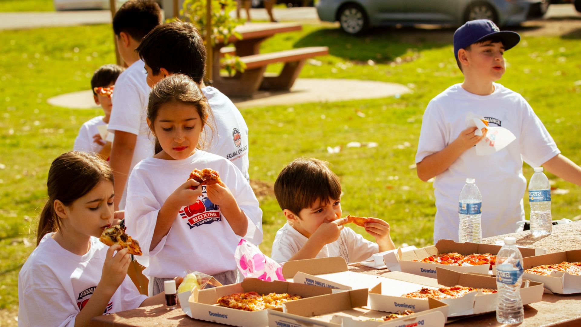 action shot of kids shadow boxing under the sun