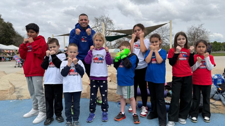 equal chance boxing foundation members in signature white t shirts