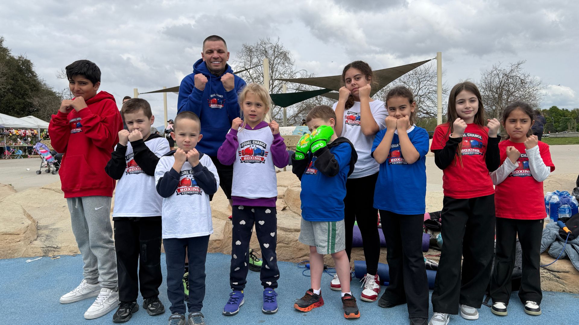 equal chance boxing foundation members in signature white t shirts
