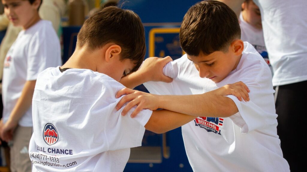 young athletes training with focus mitts in the park